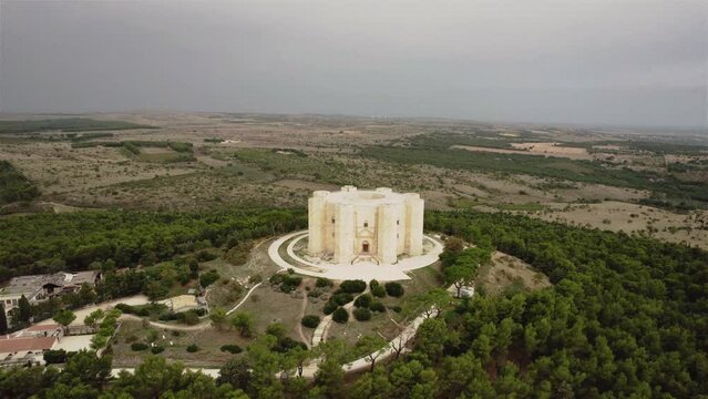 Drone flying backwards away from Castel del Monte in the south of Italy in the early morning in 4k