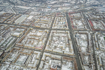 City panorama from the height of the drone flight. Residential area of brick houses in the winter. Aerial view. Nizhny Tagil, Russia