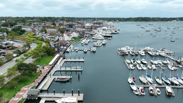 Newport Rhode Island aerial establishing shot of marina and harbor. Boats dock at Narragansett Bay. Aerial truck shot.