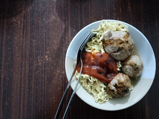 Mie Bakso (Meatballs with Noodle  Soup). Indonesian Street Food. Top View. Left Copy Space