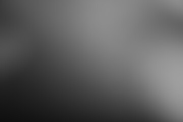 Dark black and gray blurred background has a little abstract light. soft background for...
