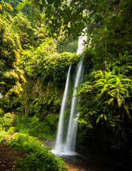 Lombok, Tiu Kelep waterfall in Senaru, Lombok, Indonesia. Tourists from overseas were enjoying the waterfall.