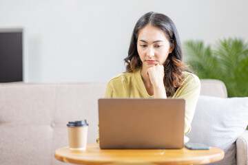 Recruitment Concept. Indian Asian Girl Browsing Work Opportunities Online, Using Job Search App or Website on Laptop, Copy Space