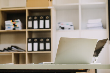 Businessman and team analyzing financial statement Finance task. with smart phone and laptop and tablet. Wealth management concept