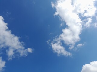 blue sky with puffy clouds background. Natural background.