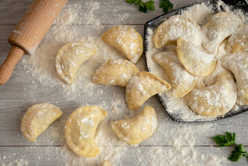 The process of making dumplings. The dumplings are just molded, but not yet ready to eat. They need to be cooked