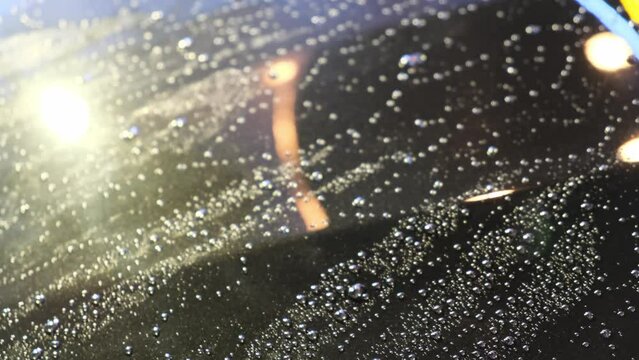 Select focus the rain droplet on the glass of the car with rain repel coating