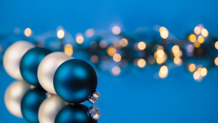 Blue and white Christmas ornaments with bokeh lights