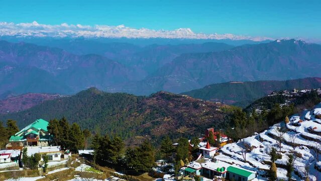 Mussoorie,Uttarakhand India- January 15 2022- Aerial winter landscape of trees and fields covered in snowfall . Snowfall in Mussoorie, Uttarakhand India. Aerial view of beautiful snow-covered