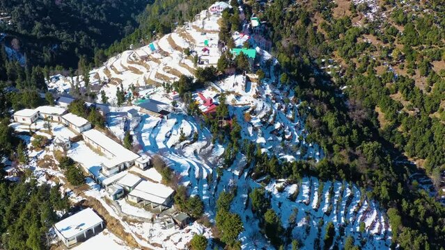 Mussoorie,Uttarakhand India- January 15 2022- Aerial winter landscape of trees and fields covered in snowfall . Snowfall in Mussoorie, Uttarakhand India. Aerial view of beautiful snow-covered