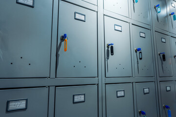 Small gray lockers compartments at pubic area