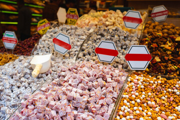 Market stall full of colorful Turkish sweets and nuts