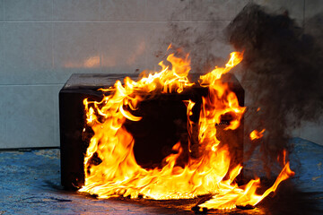 microwave oven on fire. the concept of fire in the kitchen and malfunctions, breakdowns of...
