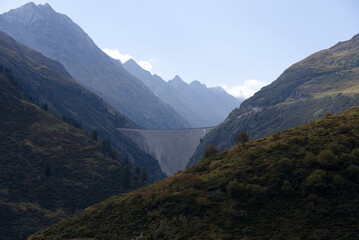 Dam Lai de Curnera in the Swiss Alps at side mountain valley of mountain pass Oberalppass on a blue cloudy late summer day. Photo taken September 5th, 2022, Oberalp Pass, Switzerland.