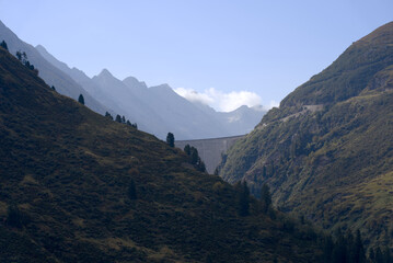 Dam Lai de Curnera in the Swiss Alps at side mountain valley of mountain pass Oberalppass on a blue cloudy late summer day. Photo taken September 5th, 2022, Oberalp Pass, Switzerland.