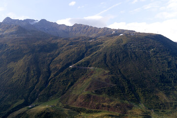 Mountain panorama at Swiss mountain pass Oberalppass on a sunny late summer morning. Photo taken...