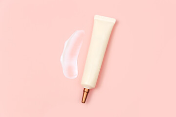 Mockup of face and eye cream squeeze cosmetic tube with long nozzle and bronze screw cap and big...