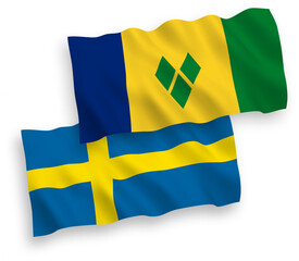 National vector fabric wave flags of Sweden and Saint Vincent and the Grenadines isolated on white background. 1 to 2 proportion.
