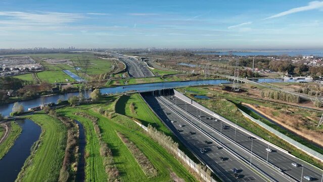Aqueduct Vechtzicht Muiden in The Netherlands. Infrastructure road, highway. river, waterway crossing and tunnel. connection between Diemen and Almere. Aerial drone view.