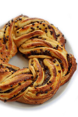 Chocolate and orange jam braided Brioche bread wreath isolated on white background