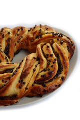 Chocolate and orange jam braided Brioche bread wreath isolated on white background