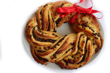 Chocolate and orange jam braided Brioche bread with red tied bow isolated on white background 