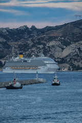 Costa cruiseship or cruise ship liner Diadema arrival into Marseille Provence port during sunrise twilight blue hour Mediterranean cruise dream vacation	