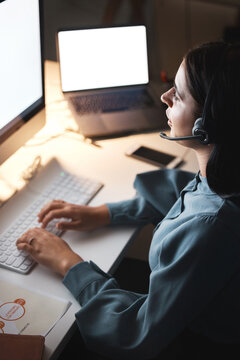 Call Center, Customer Service And Communication With A Woman Consultant Working Late At Night In Her Office. Crm, Contact Us And Support With A Female Employee At Work In Telemarketing Or Sales