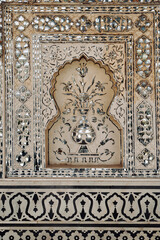 Embossed silver artwork in Amber palace, Jaipur. Floral ornament on wall in Amber Fort.