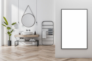 Obraz na płótnie Canvas Front view on blank white poster in black frame on light wall in eco style bathroom with round mirror above white sink in wooden cabinet and parquet floor. 3D rendering, mock up
