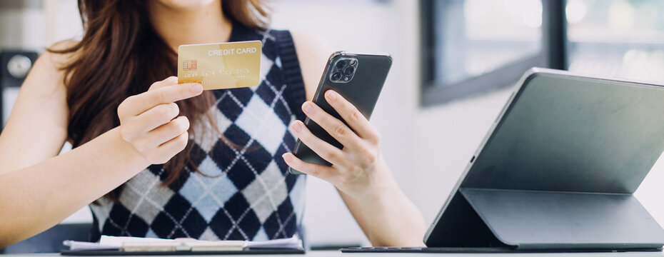 Businessman hand using laptop compter with holding cradit card payments online shopping or business.