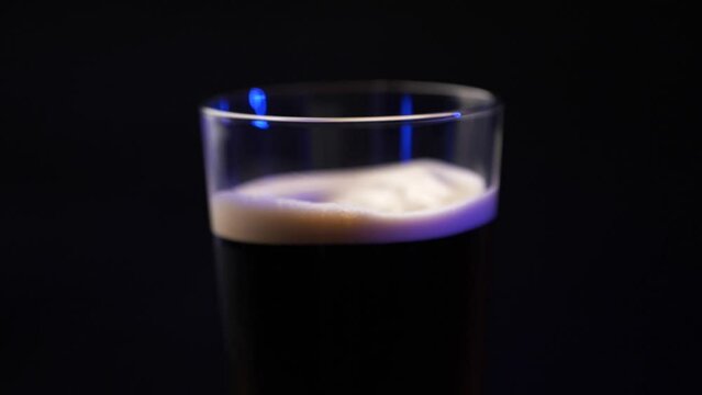 A foamy cold brew drink being mixed with air.