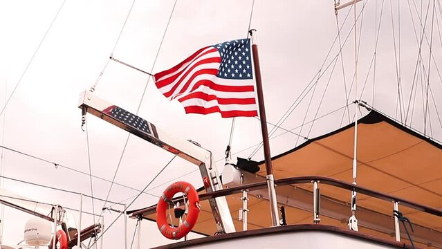 flag of the united states moving with the wind hoisted on a boat