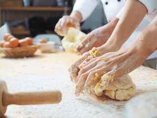 person kneading dough