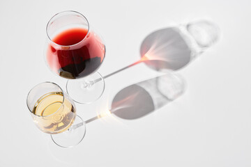 Wineglasses with red, white wine for gourmets.
