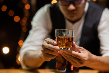 Barman pouring whiskey whiskey glass beautiful night