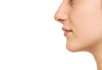 Obraz premium Closeup profile of female s nose and lips with no makeup on a white background