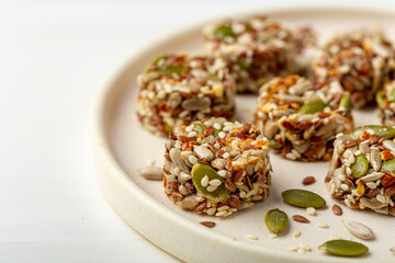 Small round bars made of seeds and honey