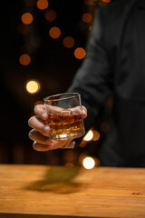 Barman pouring whiskey whiskey glass beautiful night