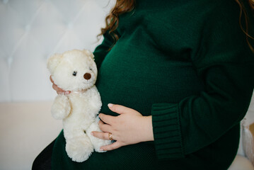Background with pregnant belly and toy