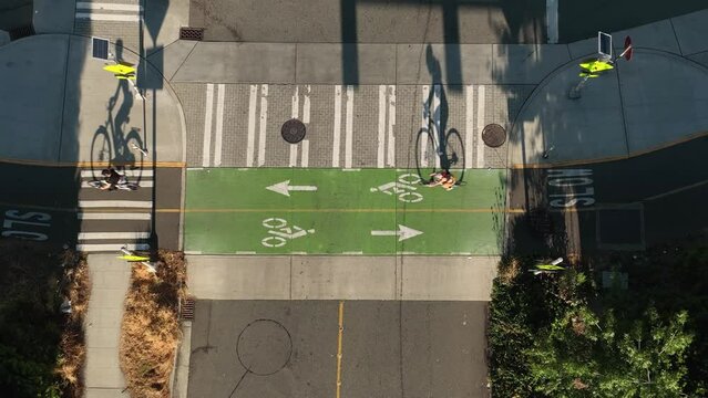 Overhead shot of bikers riding along a designated bike lane in downtown Seattle.