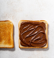Overhead shot of a wheat bread with chocolate spread on it