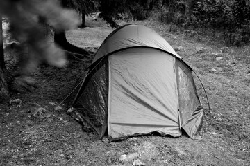 tent in the forest. Black and white toned image 
