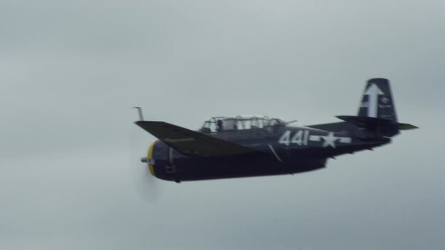 World War 2 fighter plane flys past low to ground 