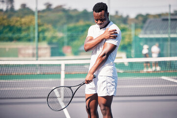 Sports, tennis and arm pain on court after training, game or match outdoors. Healthcare, tennis player and injured black man or athlete with muscle pain or inflammation after exercise or workout.