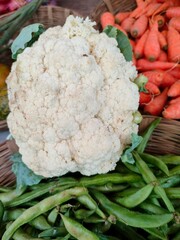 Cauliflower in market with beans and carrot