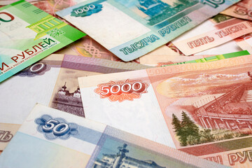 Banknote 5000 rubles. Background with paper Russian banknotes. Cash banknotes of various denominations. Currency exchange. Financial crisis in Russia. Money to pay for loan, shopping, travel, tourism
