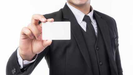 businessman handsome man wear a suit holding and showing empty business card , credit card or name card for advertising banner isolated on white background with copy space - business concept