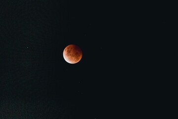 Blood super moon in a dark sky