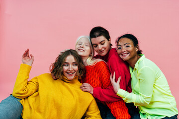 group of multiethnic women with different kind of skin posing together in studio. Concept about body positivity and self acceptance - obrazy, fototapety, plakaty